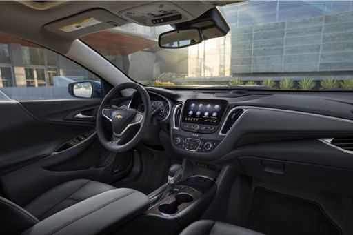 2024-Chevrolet-Malibu-Press-Photos-Interior-001-cockpit-dash-steering-wheel-center-stack-infotainment-display-screen-gear-shift-selector-center-console-720x480